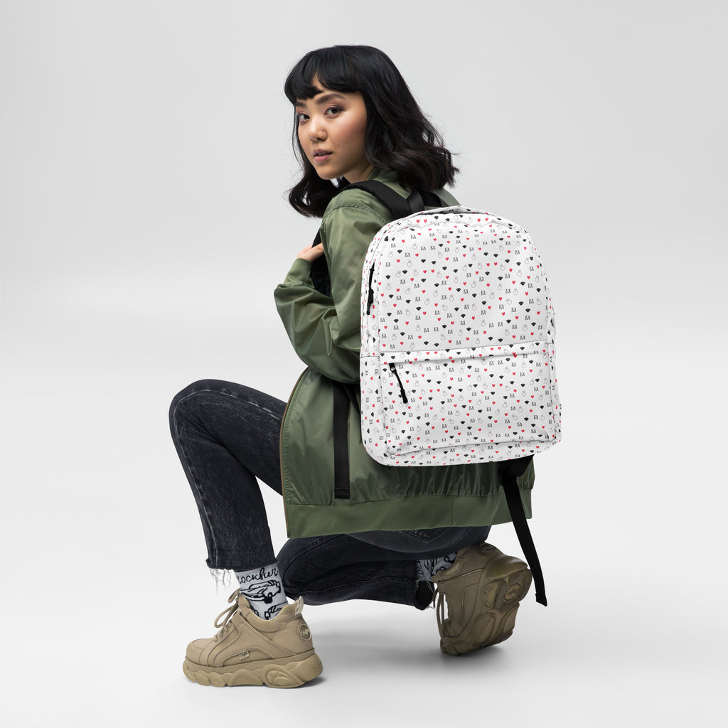 Daemon Luxury Speckled Diamonds Artica Blizzard backpack with all-over white print and black diamond pattern on the front.