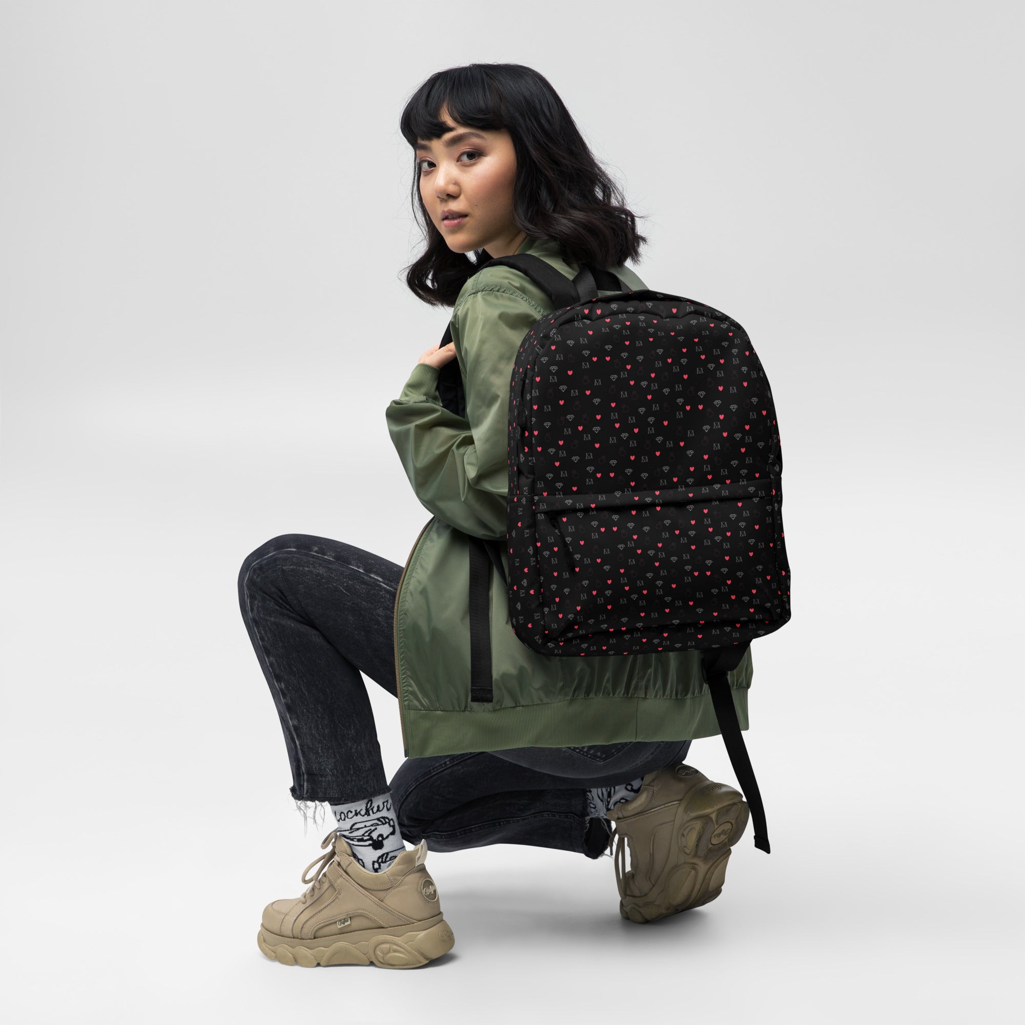 White Daemon Luxury Speckled Diamonds (NEMESIS) backpack with an all-over print, featuring bold, modern diamond patterns.