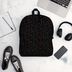 Daemon Luxury Speckled Diamonds NEMESIS backpack with all-over white print, featuring a stylish, modern design and adjustable straps.
