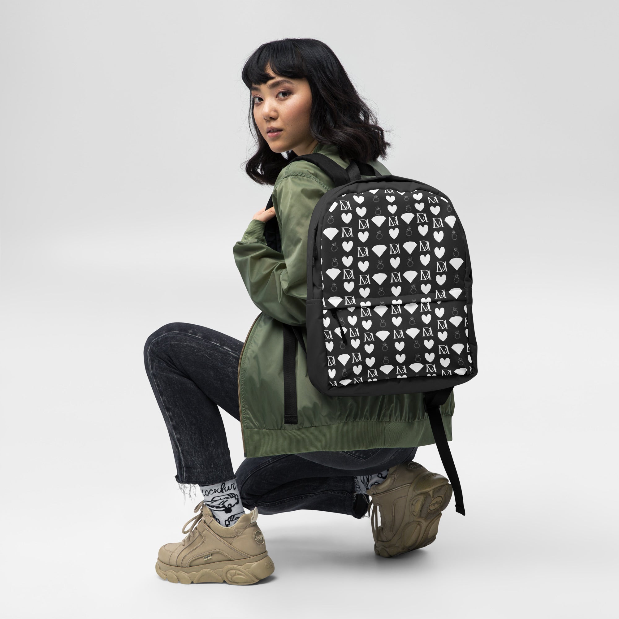 Daemon Luxury Frosted Diamonds Zaino backpack with an all-over white print, featuring a stylish and modern design.