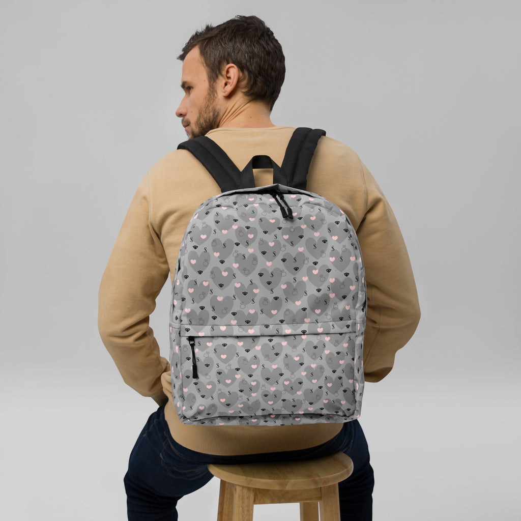 White Heartfelt STF Zaino backpack by Daemon Luxury with all-over print design, showcasing a stylish and functional accessory.