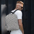 White Heartfelt STF (NARDO Scale) backpack by Daemon Luxury with all-over print, showing the front view and detailed design.