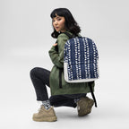 Daemon Luxury Rings of Transition Frosted Diamonds backpack with all-over white print, front view showing detailed design.