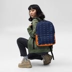 All-over-print white backpack featuring Stars of Sesta (Gloomy Runners) design by Daemon Luxury, with adjustable straps and front pocket.