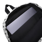 Daemon Luxury Dim Diamonds Artica Blizzard backpack with all-over white diamond pattern, featuring durable fabric and adjustable straps.