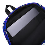 Daemon Luxury ELECTRICA all-over-print backpack featuring a white design with intricate details and sturdy straps.