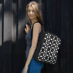 White Daemon Luxury Frosted Diamonds backpack with an all-over print, featuring a stylish and modern design for everyday use.