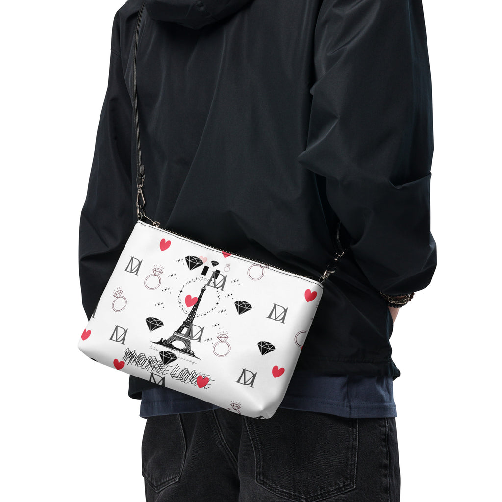Daemon Luxury Metronome Paris crossbody bag with all-over black print, featuring a stylish and compact design.