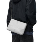 Black NARDO Scale Sunless Dream crossbody bag by Daemon Luxury with all-over print and adjustable strap.