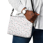 Daemon Luxury Speckled Diamonds Artica Blizzard crossbody bag with all-over black and white diamond pattern and adjustable strap.