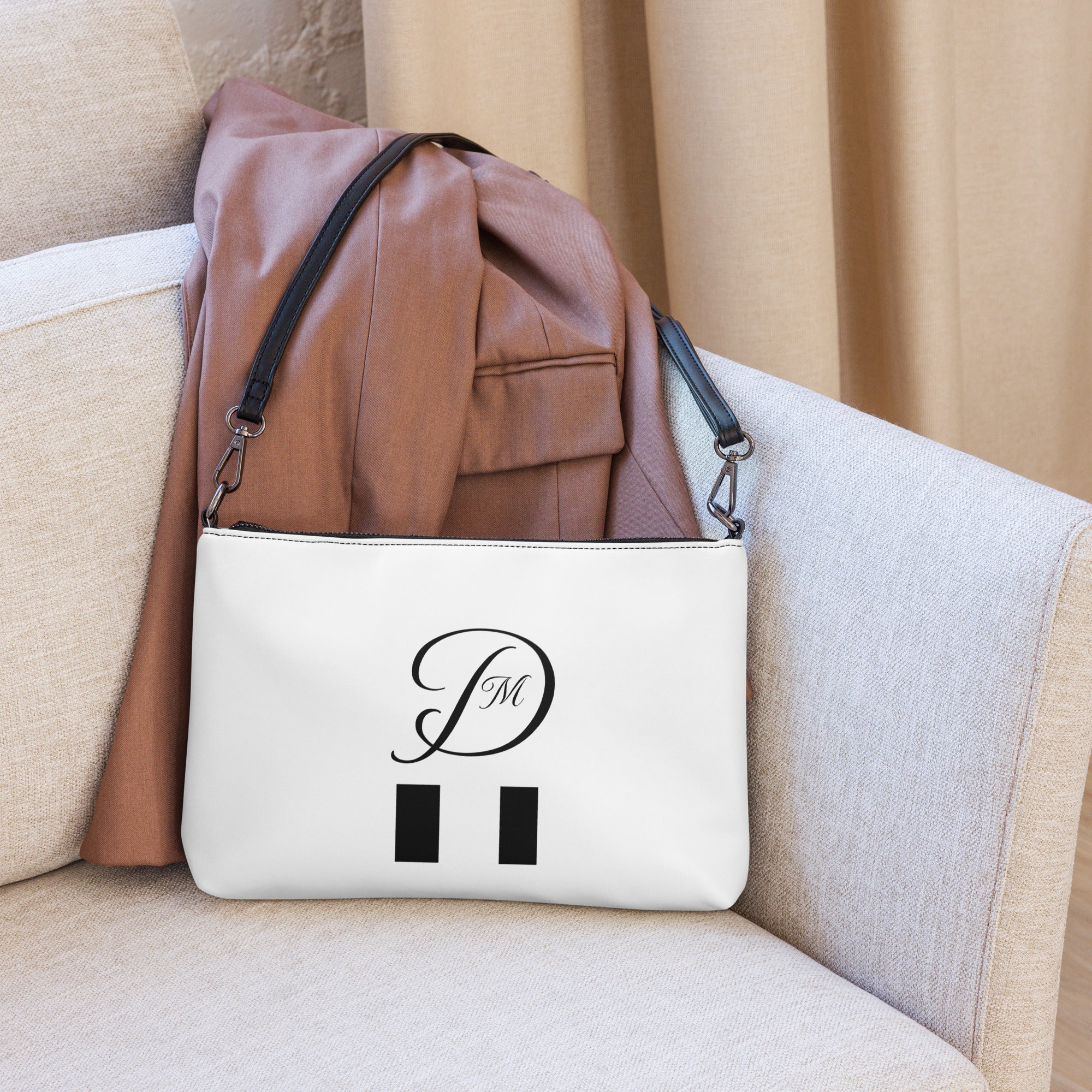 Daemon Luxury Metronome Paris More Love crossbody bag with all-over black print, stylish and compact accessory.