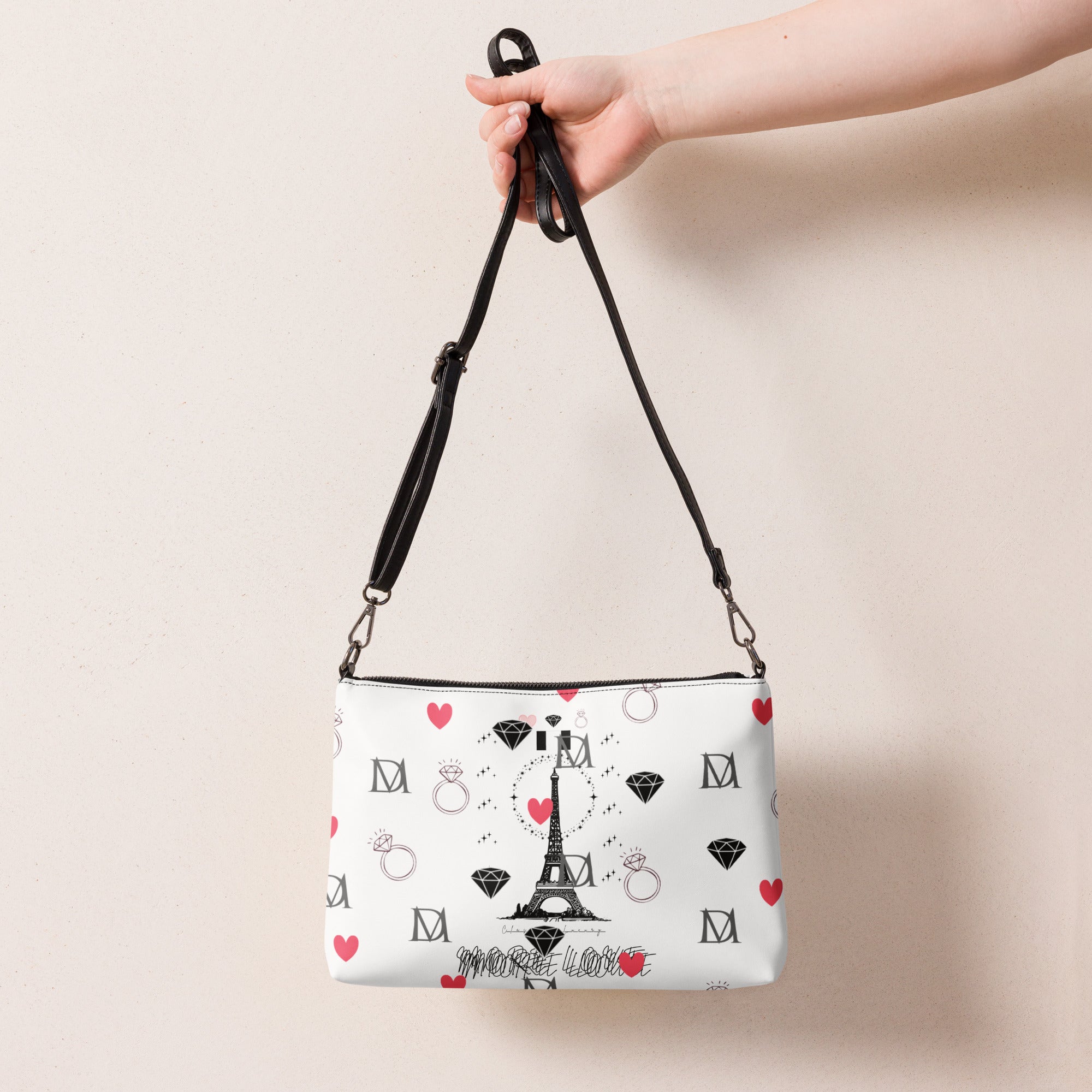Black all-over-print crossbody bag featuring the Metronome Paris (More Love) design by Daemon Luxury.