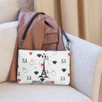 Daemon Luxury Metronome Paris crossbody bag with all-over black print and adjustable strap, stylish and functional accessory.