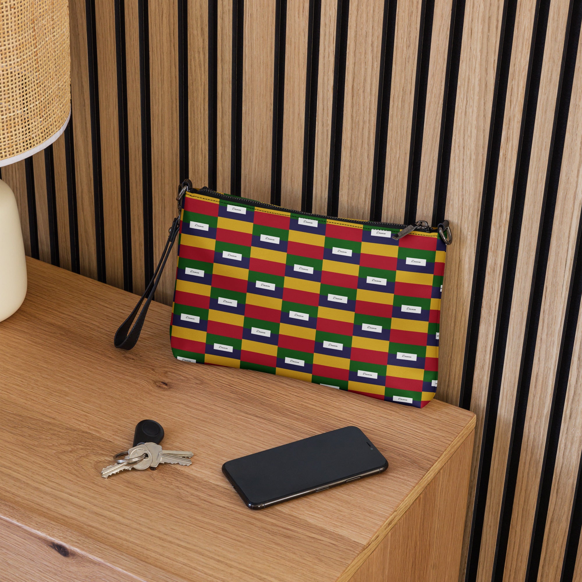 Black crossbody bag by Daemon Luxury with all-over ruby stones print, featuring a sleek design and adjustable strap.