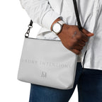 Black NARDO Scale sunless dream crossbody bag by Daemon Luxury with all-over print and adjustable strap.