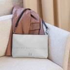 Black NARDO Scale sunless dream Borsetta crossbody bag by Daemon Luxury with all-over print, front and back view.