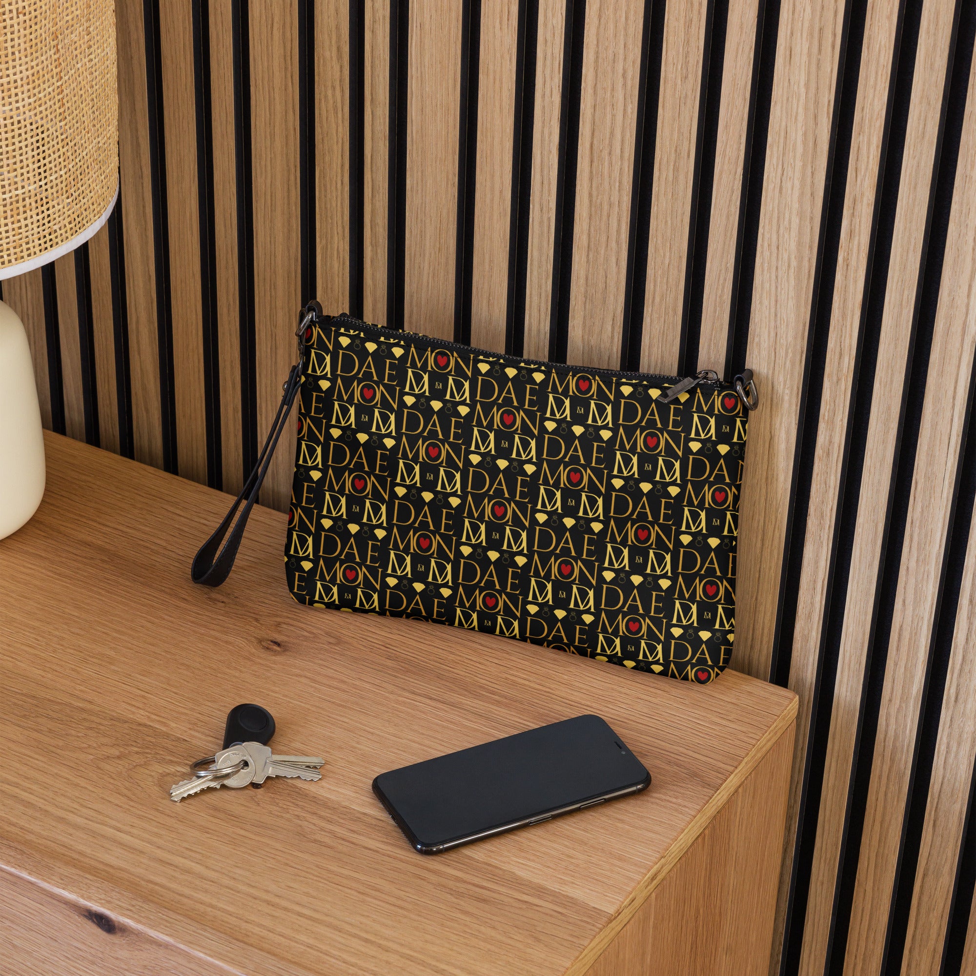 Daemon Luxury Sun Glow California Borsetta crossbody bag with all-over black print and adjustable strap.