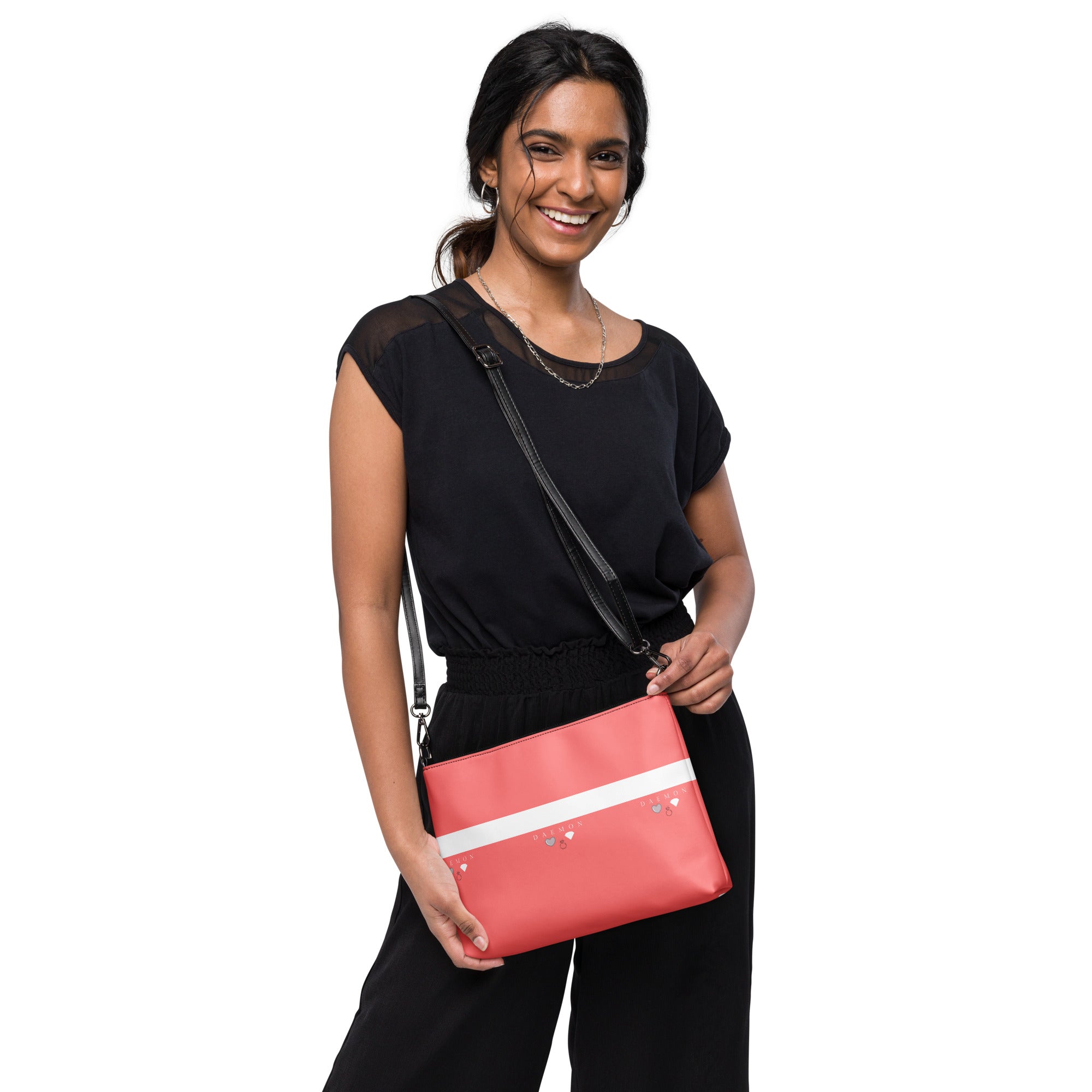 Black Daemon Luxury SACHI BANS crossbody bag with all-over white label print, front view showing stylish design and adjustable strap.