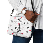 Daemon Luxury Metronome Paris Borsetta crossbody bag with all-over print, black leather with detailed design on the front.