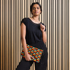 Black crossbody bag with all-over ruby stones print by Daemon Luxury, featuring a compact design and adjustable strap.