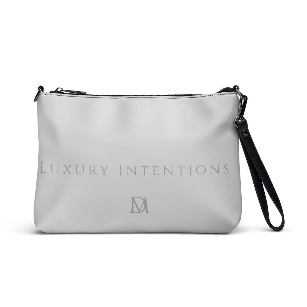 Black NARDO Scale all-over-print crossbody bag by Daemon Luxury with adjustable strap and stylish design.