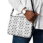 Daemon Luxury Dim Diamonds Artica Blizzard black crossbody bag with all-over print and adjustable strap, front view.