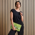 Daemon Luxury Belly Red’s Garden Rebirth Borsetta crossbody bag with all-over black floral print, front view.