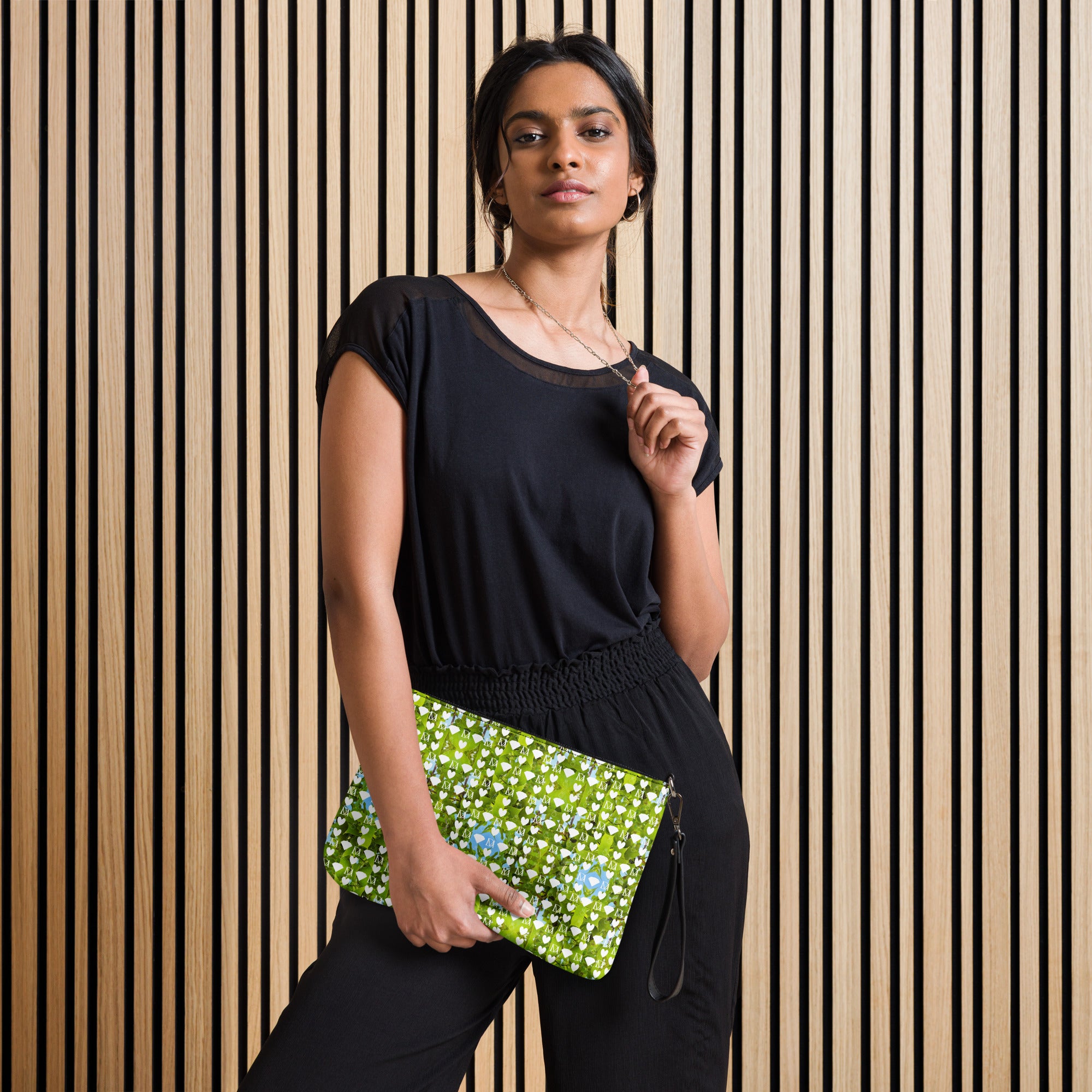Daemon Luxury Belly Red’s Garden Rebirth Borsetta crossbody bag with all-over black floral print, front view.