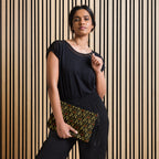 Daemon Luxury Sun Glow California Borsetta crossbody bag with black all-over print, front view showing stylish design and strap details.