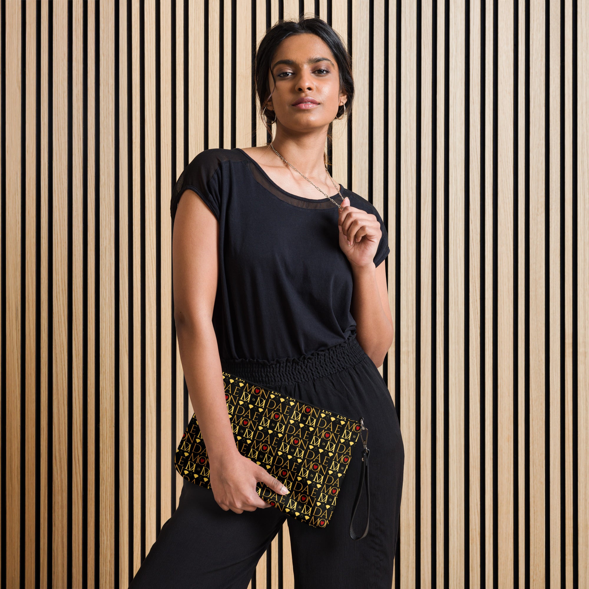 Daemon Luxury Sun Glow California Borsetta crossbody bag with black all-over print, front view showing stylish design and strap details.