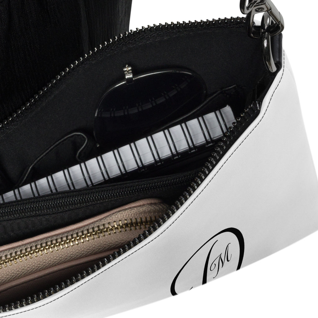 Daemon Luxury Metronome Paris More Love crossbody bag with all-over black print, stylish and compact accessory.