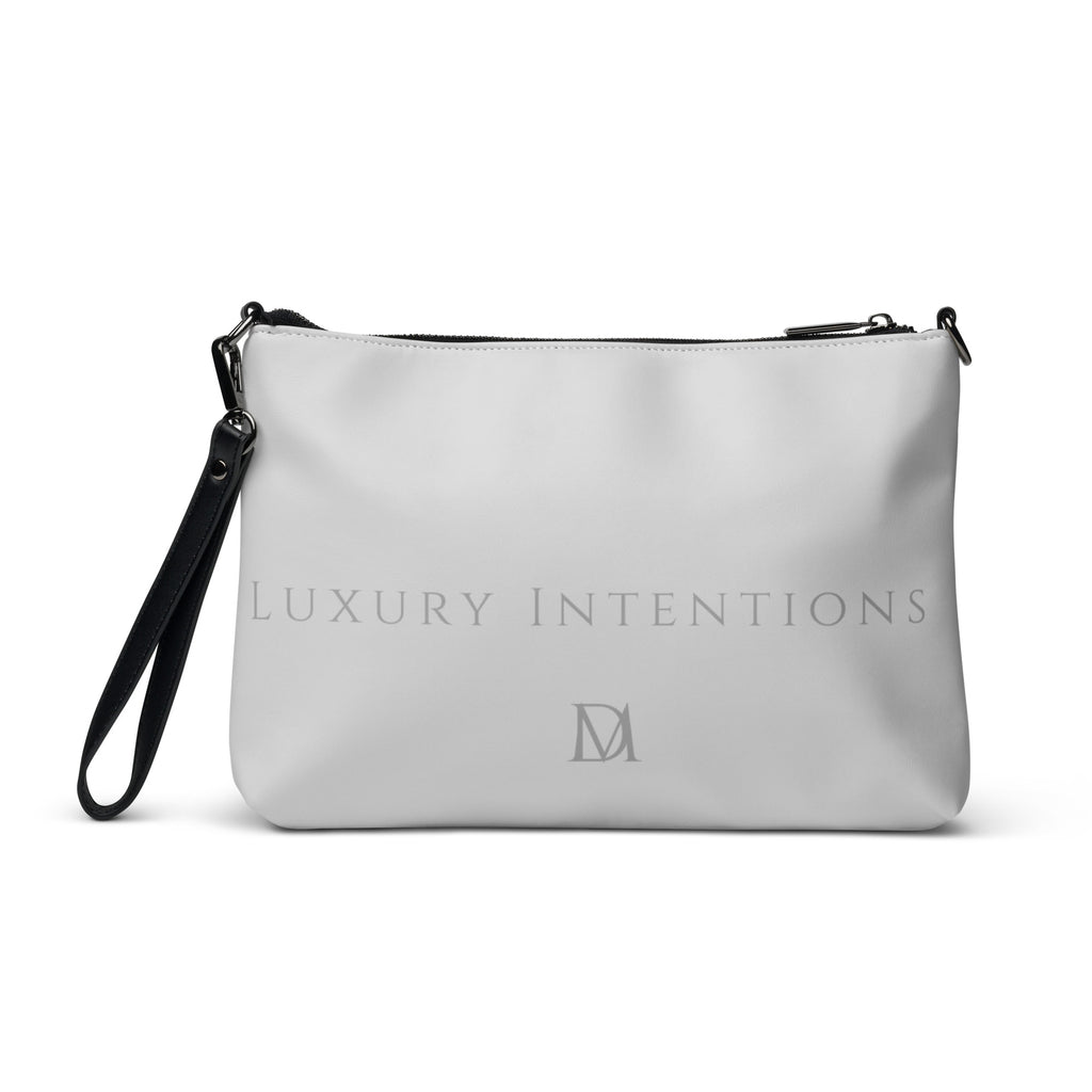 White NARDO Scale sunless dream crossbody bag by Daemon Luxury with all-over print and adjustable strap.
