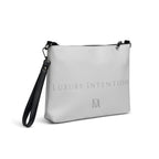 NARDO Scale all-over-print crossbody bag by Daemon Luxury, white with vibrant abstract pattern, shown from right back view.