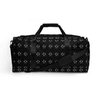White Makara Coroner Borsone duffle bag with all-over print featuring bold Daemon branding and graphic design on the front.