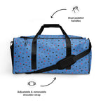 Daemon Luxury speckled diamonds all-over-print duffle bag in white with black and gray diamond pattern on front.