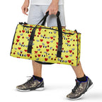 Daemon Luxury Foreigners Luv Solar Butter all-over print duffle bag in white with vibrant design, front view showing detailed pattern.