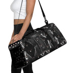 Daemon Luxury Southgate Treasured Borsone all-over-print duffle bag in white with bold, intricate design and sturdy handles.