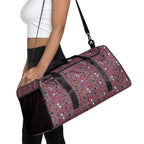 Daemon Luxury Carnival Bay Picasso Mirrors Borsone duffle bag with all-over white print, featuring artistic mirror designs on the front.