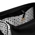 Daemon Luxury Dim Diamonds Artica Nero duffle bag with all-over diamond print, white interior pocket and sturdy handles.