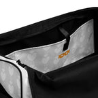 Frosted Heartfelt sunless self-tanning product by Daemon Luxury, with all-over print duffle bag featuring white inside pocket.