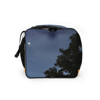 Daemon Luxury Crescent City Borsone duffle bag with all-over print, white background, showing the left side with detailed design.