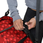 Daemon Luxury Supreme Models Foreigners Luv all-over-print duffle bag in white with bold graphic design.