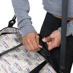 Daemon Luxury Honeybee Intel forecast duffle bag with all-over white print, featuring detailed honeybee and intel graphics.