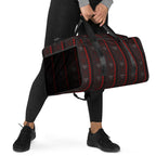 Daemon Luxury Supreme Models More Less Love all-over-print duffle bag in white, front view showing bold design and spacious storage
