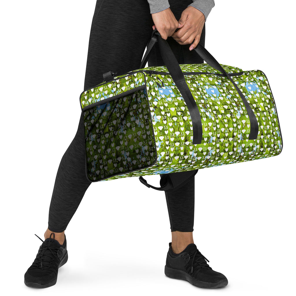 Daemon Luxury Belly Red’s Garden (Rebirth) duffle bag with all-over-print design, white background, right front view.