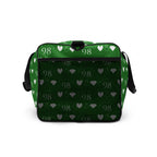 Daemon Luxury Belly Red’s Garden Borsone duffle bag with all-over floral print on white background, right side view.
