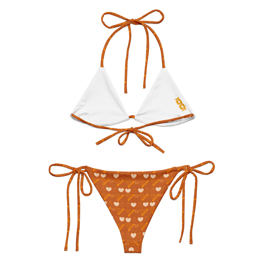 Daemon Luxury Gloomy Runner Honey Sesta all-over-print recycled string bikini with white background and intricate design.