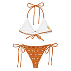 Daemon Luxury Gloomy Runner Honey Sesta all-over-print recycled string bikini with white background and intricate design.