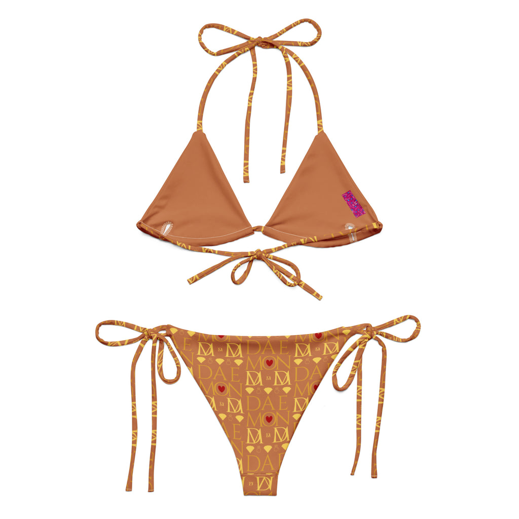 Daemon Luxury Tarmin Dim Sun Glow Dulce Scusa recycled string bikini with all-over white print, shown from the back.