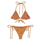 Daemon Luxury Tarmin Dim Sun Glow Dulce Scusa recycled string bikini with all-over white print, shown from the back.